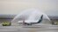 A plane of former state airline Mexicana de Aviacion receives a water salute before taking off from the military-run Felipe Angeles International Airport in Zumpango, Mexico, Dec. 26, 2023. (Mexico Presidency/Handout via REUTERS)