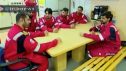 This photo released by state-run IRIB News Agency, which aired July 22, 2019, shows various crew members of the British-flagged tanker Stena Impero, which was seized by Tehran in the Strait of Hormuz on Friday, during a meeting.