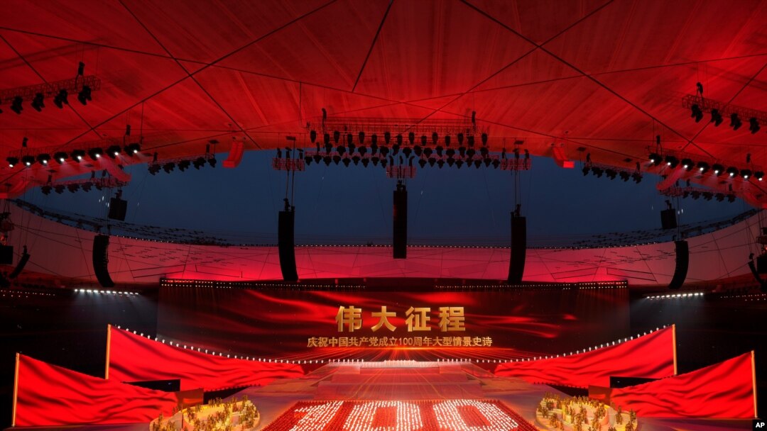 Performers form the number 100 at a gala show ahead of the 100th anniversary of the founding of the Chinese Communist Party in Beijing on June 28, 2021. 