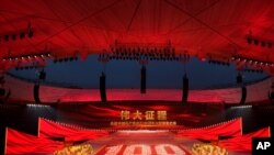 Performers form the number 100 at a gala show ahead of the 100th anniversary of the founding of the Chinese Communist Party in Beijing on June 28, 2021. 