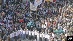 Demonstrators take part in a protest against Syria's President Bashar al-Assad after Friday prayers in Baba Amro, near Homs, February 3, 2012.