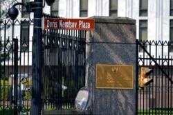 A street sign marking Boris Nemstov Plaza is seen at the entrance of the Embassy of the Russian Federation in Washington, April 15, 2021.