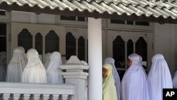 Members of the Ahmadiyah community attend Friday prayers at the An-Nur Mosque in Manis Lor village, in Kuningan, West Java. Indonesian Foreign Minister Marty Natalegawa defended the country's judicial system after a court sentenced Muslim radicals to a fe