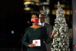 Atlanta Mayor Keisha Lance Bottoms lights this year's Macy's Great Tree at a private ceremony on Nov. 12, 2020, in Atlanta.