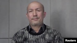 FILE - A man who identifies himself as Uighur poet and musician Abdurehim Heyit is seen in this still image taken from a video posted online by China Radio International's Turkish language service on Feb. 10, 2019.