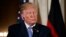 President Donald Trump listens to a question during a news conference with German Chancellor Angela Merkel in the East Room of the White House, April 27, 2018, in Washington. 