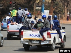 Police patrol the streets as vote counting for the general election progresses in Harare, Zimbabwe on Aug. 26, 2023.