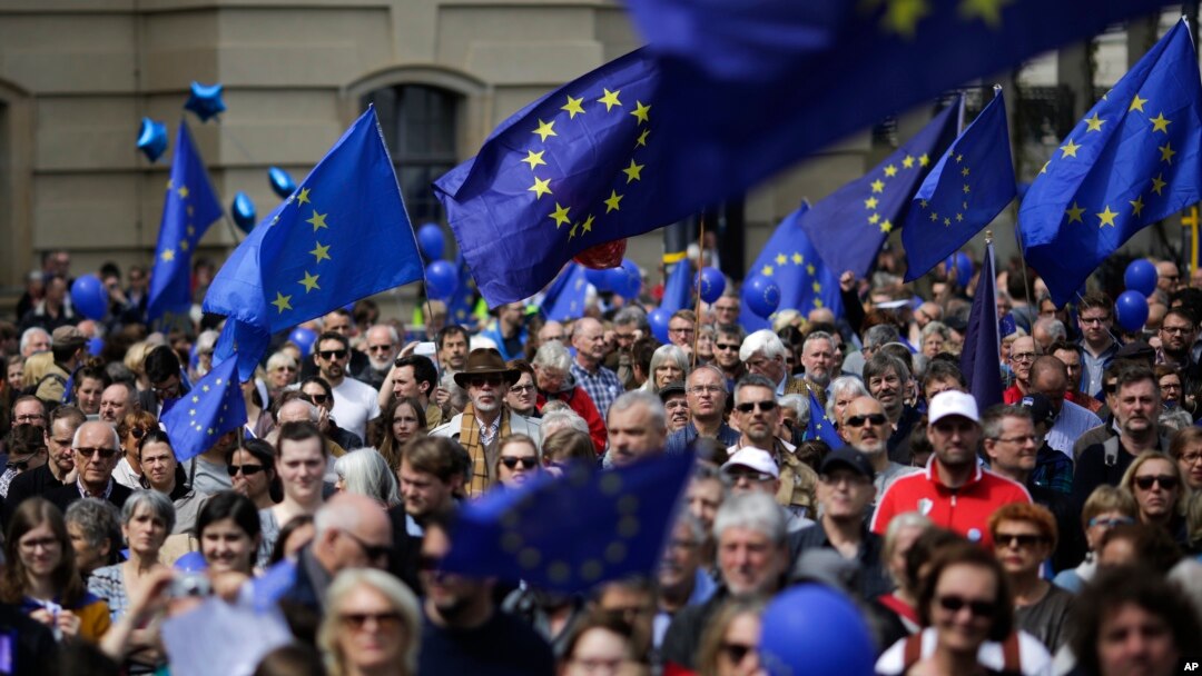 FILE - Hundreds of people attend a rally of the Pulse of Europe movement in Berlin, May 7, 2017. Pulse of Europe goes to the streets equipped with the symbols of Europe to demonstrate for a united Europe.