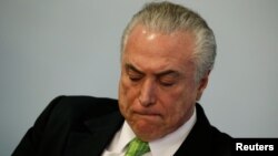 Brazil's President Michel Temer reacts during a ceremony in commemoration of the World Environment Day, at the Planalto Palace in Brasilia, Brazil, June 5, 2017. 