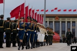 Members of a grant   defender  rehearse earlier  a ceremonial  to people    Martyrs' Day up  of the 75th day  of the founding of the People's Republic of China connected  Tiananmen Square successful  Beijing, Sept. 30, 2024.