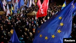 People attend a meeting to support EU integration at European square in Kiev, Ukraine, Nov. 25, 2013.