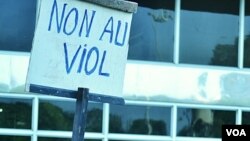 A Malian man holds a sign that reads: 'No to rape.' There are reports of rapes in regions taken by Tuareg rebels and Islamic militants in northern Mali, April 4, 2012. (VOA - N. Palus)