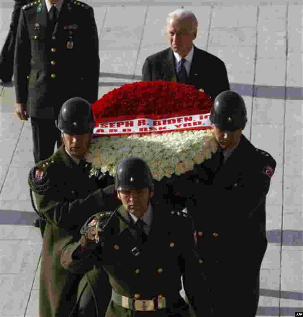 U.S. Vice President Joe Biden, rear, follows a Turkish guard of honour during a wreath laying ceremony at the mausoleum of Kemal Ataturk, the founder of modern Turkey, in Ankara, Turkey, Friday, Dec. 2, 2011. Biden called on Turkey to impose new sanctions