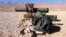 A pro-regime soldier aims a rocket launcher towards rebel locations in the Qalamoun region on the outskirts of the Syrian capital Damascus, Feb. 13, 2014. 