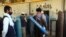 A man carries an oxygen tank from a privately owned oxygen factory in Kabul, Afghanistan, June 18, 2020. For seven years, Najibullah Seddiqi's oxygen factory sat idle. Now he refills hundreds of oxygen cylinders a day for free for COVID patients.