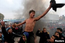 Palestinian students take part in a protest against the U.S. President Donald Trump's Middle East peace plan, in the southern Gaza Strip.