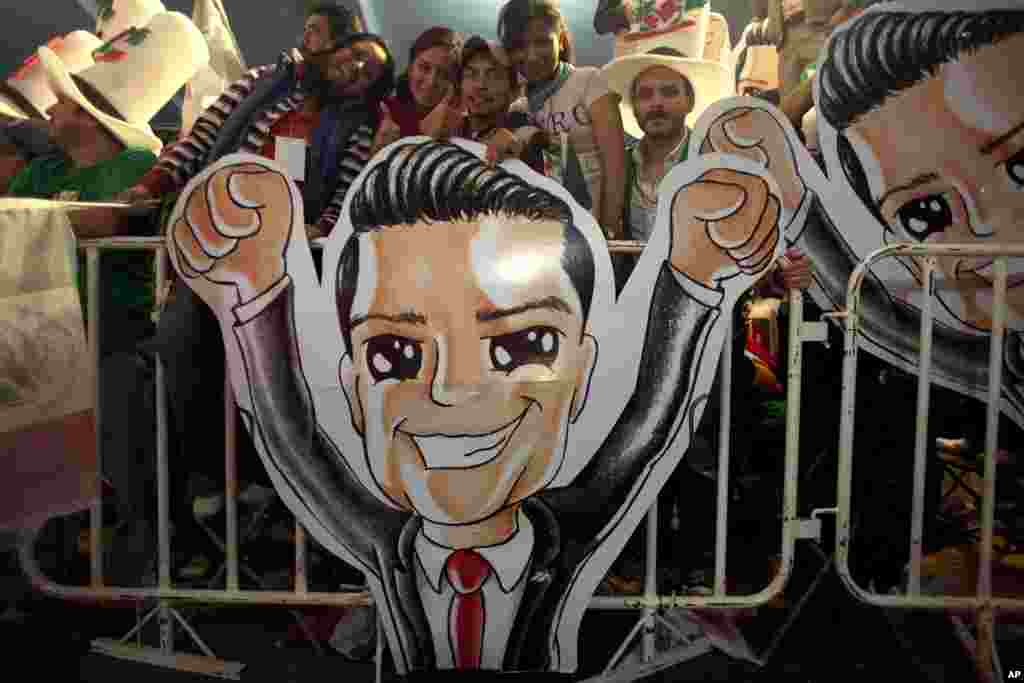 Supporters of Enrique Pena Nieto celebrate at party headquarters as exit polls begin to come in, Mexico City, July 1, 2012.