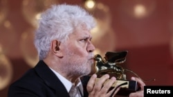 Director Pedro Almodovar poses with his Golden Lion Award for Best Film for the movie "The Room Next Door", during the 81st Venice Film Festival, Italy, Sept. 7, 2024. 