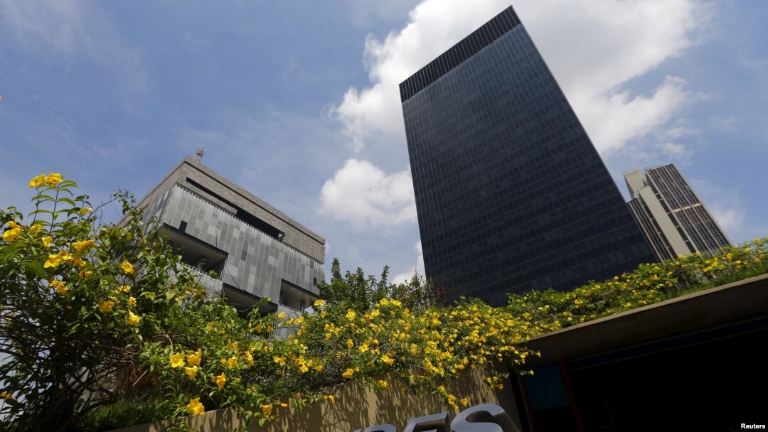 FILE - The headquarters of oil company Petrobras (L) is pictured next to the headquarters of Brazilian Development Bank (BNDES) in Rio de Janeiro. Investigators are continuing to probe a massive political kick-back scheme centered on the state-run oil company.