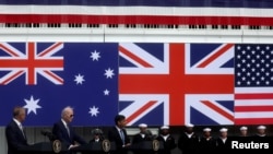 FILE - U.S. President Joe Biden, Australian Prime Minister Anthony Albanese and British Prime Minister Rishi Sunak deliver remarks on the Australia-United Kingdom-U.S. partnership after meeting at Naval Base Point Loma in San Diego, California, March 13, 2023. 