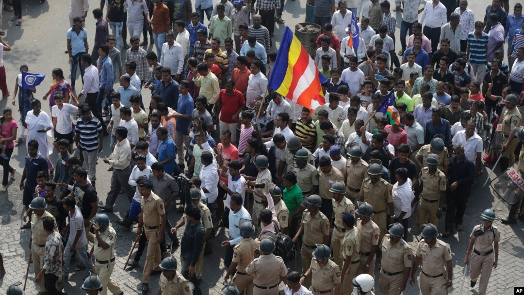 Protesters march during a strike called by Dalit groups in Mumbai, India, Jan 3, 2018.