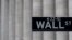 FILE - A Wall Street sign near the New York Stock Exchange is seen in New York City, May 8, 2020.