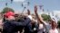 FILE - Donald Trump greets the crowd at the Iowa State Fair in Des Moines, Aug. 15, 2015, when he was a candidate for the Republican presidential nomination. 