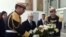 Tunisian President Beji Caid Essebsi, center, lays a wreath at the entrance of the National Bardo Museum in Tunis to pay tribute to the victims of the deadly attack last week claimed by the Islamic State jihadist group, March 22, 2015.  