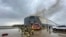 This photo provided by The Jacksonville Fire and Rescue Department shows firefighters responding to a fire after an explosion aboard a ship, June 4, 2020 in Jacksonville, Fla.