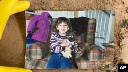 A childhood photo of Samira Zoobi, a 28-year-old who died in Hurricane Helene, was returned to their parents. (Taylor Schenker via AP)