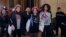 Activists of Ukrainian women's rights group Femen leave the Paris courthouse, Oct. 29, 2015, after they were acquitted in appeal over a topless demonstration they staged inside Notre-Dame Cathedral in February 2013. 