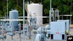 FILE - A Colonial Pipeline station is seen May 11, 2021, in Smyrna, Georgia, near Atlanta. Colonial Pipeline, which delivers about 45% of the fuel consumed on the East Coast, halted operations after revealing a cyberattack it said had affected some of its systems.