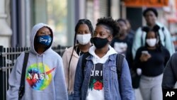 Students arrive for the first day of in-person classes at Erasmus High School in Brooklyn's Flatbush neighborhood, Oct. 1, 2020 in New York. 