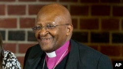 Desmond Tutu, right, in The Hague, Netherlands, Nov. 18, 2014.