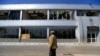 A man stands in front of a damaged building at Sanaa international airport on Dec. 27, 2024, following Israeli strikes at the site the previous day. 