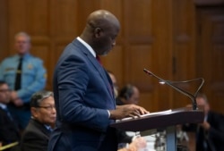 Gambia's Justice Minister Aboubacarr Tambadou addresses judges of the International Court of Justice for the first day of three days of hearings in The Hague, Netherlands, Dec. 10, 2019.
