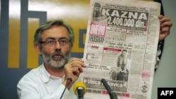 FILE - A Serbian appeals court on Feb. 2, 2024, freed four former intelligence officers convicted in the 1999 killing of Slavko Curuvija, editor and owner of the newspaper Dnevni Telegraf, shown here at a press conference in Belgrade in 1998.