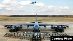 United States B-52 bomber, as shown in the above photo, is training over South Korea. (Courtesy - U.S. Air Force)