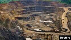 File - Excavators and drillers at work in an open pit at Tenke Fungurume, a copper and cobalt mine 110 kilometers northwest of Lubumbashi in Congo's copper-producing south, owned by miner Freeport McMoRan, Lundin Mining and state mining company Gecamines.