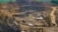 FILE - Excavators and drillers at work in an open pit at Tenke Fungurume, a copper and cobalt mine 110 kilometers northwest of Lubumbashi in Congo's copper-producing south, owned by miner Freeport McMoRan, Lundin Mining and state mining company Gecamines.