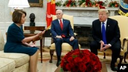 FILE - Vice President Mike Pence, center, looks on as House Minority Leader, now House Speaker, Rep. Nancy Pelosi, and President Donald Trump argue during a meeting in the Oval Office of the White House, Dec. 11, 2018, in Washington.