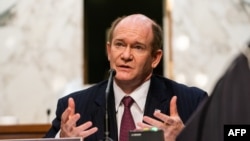 FILE -Senator Chris Coons (D-Del.) asks a question as Judge Merrick Garland testifies before a Senate Judiciary Committee hearing, Feb. 22, 2021.