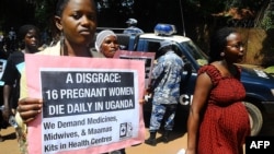 Activists hold a peaceful march in the capital Kampla to protest the delay by a Ugandan court to deliver a ruling in a landmark lawsuit regarding the cases of two women who unattended bled to death during childbirth.