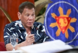 FILE - Philippine President Rodrigo Duterte attends a meeting at the Malacanang presidential palace in Manila, Oct. 5, 2020.