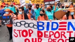FILE - Supporters of immigration reform march while asking for a path to citizenship and an end to detentions and deportations, April 28, 2021, in Washington. 
