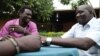 Gatdet Thong (L) meets with other "Cuban Jubans" wearing beaded bracelets with South Sudan's new flag colours, Juba, South Sudan, August 2012. (H. McNeish/VOA)