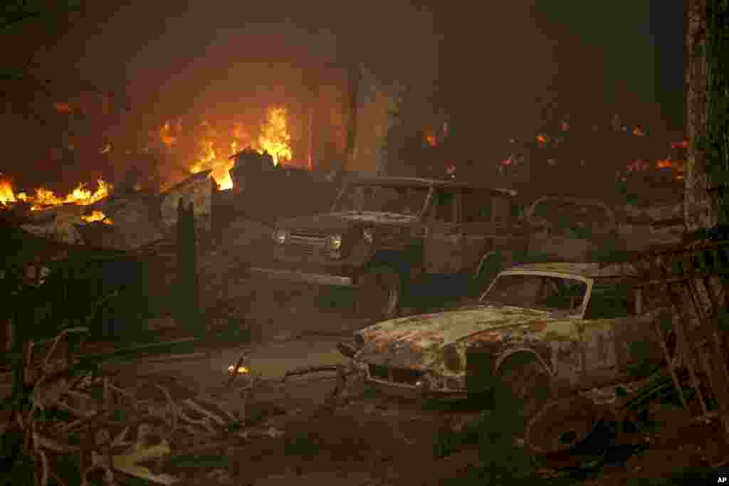 Vehicles sit destroyed after the Airport Fire swept through, Sept. 10, 2024, in El Cariso, an unincorporated community in Riverside County, California.