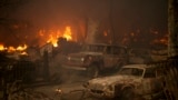 Vehicles sit destroyed after the Airport Fire swept through, Sept. 10, 2024, in El Cariso, an unincorporated community in Riverside County, California.