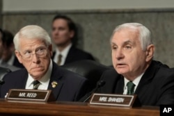 U.S. Senator Jack Reed, a Democrat, right, gives opening remarks as Senator Roger Wicker, a Republican, looks on during the Senate Armed Services Committee confirmation hearing for Pete Hegseth at the Capitol in Washington on Jan. 14, 2025.