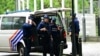 Belgian police stand guard outside, on the sideline of searches conducted at the European Parliament building as part of a Belgian probe into suspected Russian interference and corruption in Brussels on May 29, 2024.
